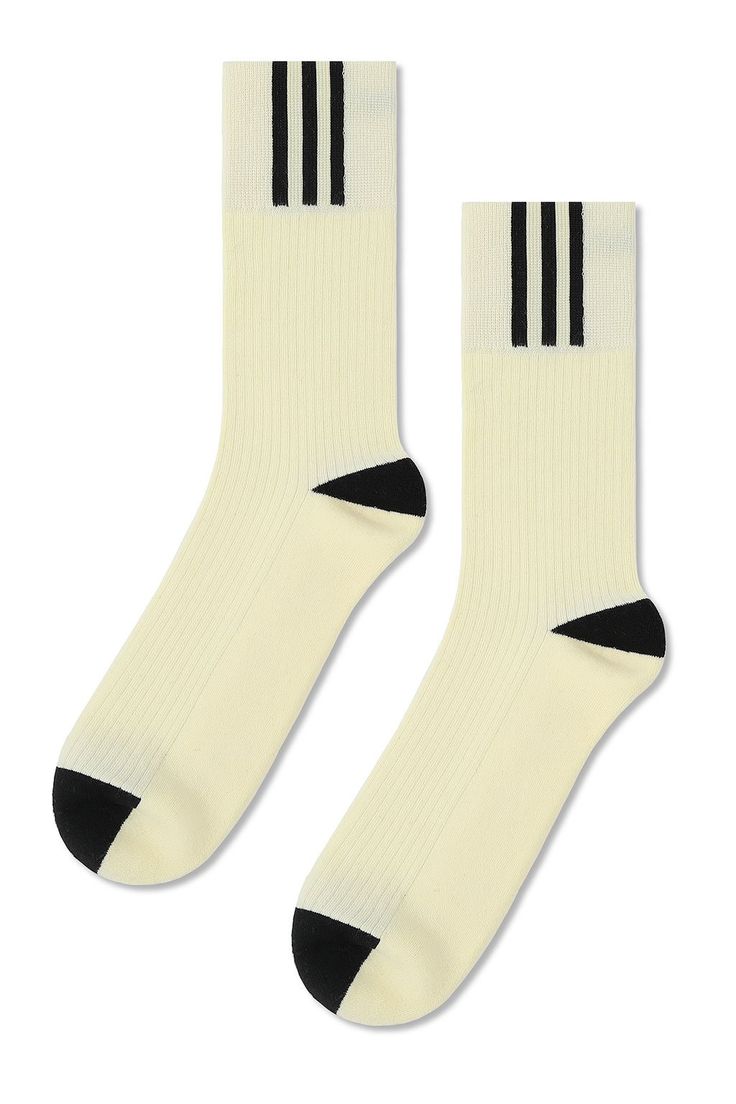 Our Split Crew gives a twist to your everyday basic. These premium combed cotton socks feature a larger cuff with side stripe detail a terry footbed and arch support. Size+ OSFA, M 9-12 Design+ 200 Needle+ Reinforced toe & heel+ Seamless toe+ Classic Ribbed Tube Sock+ Terry Cushioning on Footbed+ Crew Content + Care+ Premium Combed Cotton+ Wash Cold/Dry Low+ Imported Sporty Winter Socks With Ribbed Cuffs, Winter Sporty Socks With Ribbed Cuffs, Sporty Black Socks For Spring, Crew Sock, Split Dress, Tube Socks, Cotton Socks, Side Stripe, Arch Support