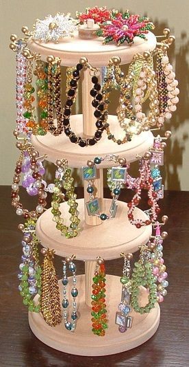 there is a jewelry rack on the table