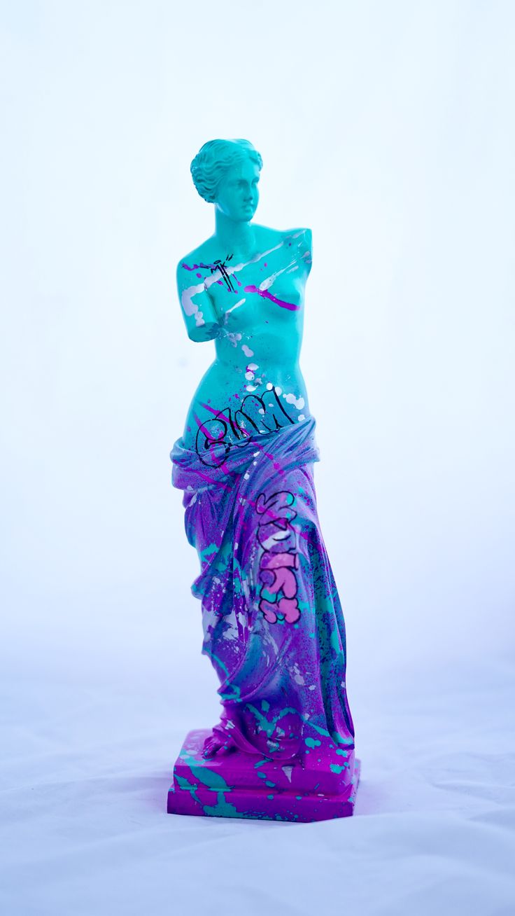 a blue and purple statue is shown against a white background with the word art written on it