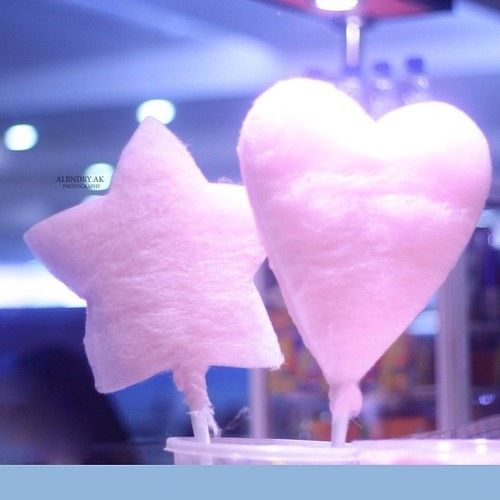 two heart shaped lollipops sitting on top of each other