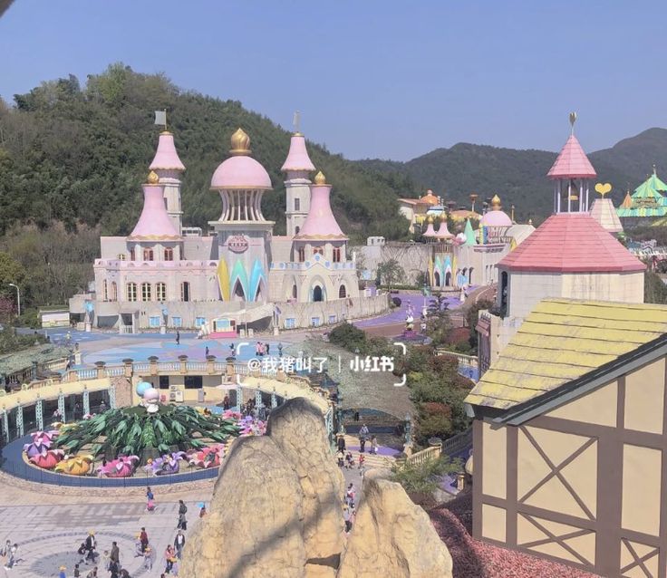 an amusement park with lots of rides and buildings