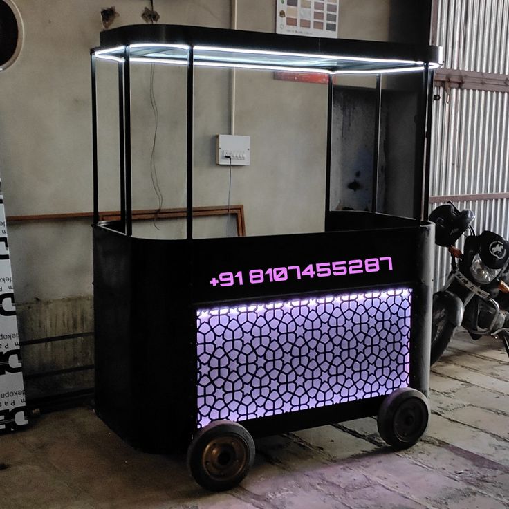 a black cart with purple lights on it