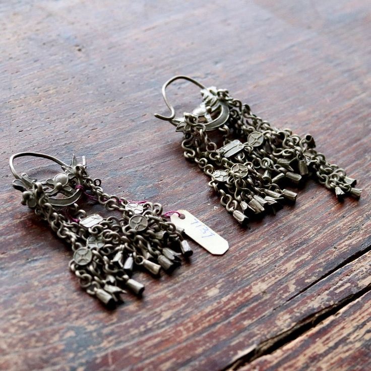 These dangle earrings are antiques that originate from the Qing Dynasty, where a noble woman would have worn an intricate design such as this for a special occasion.Antique stock, made by hand in the late 19th or early 20th century. Length 3 1/2 to 4 1/2 inches. Victorian Style Ceremonial Dangle Earrings, Ceremonial Vintage Earrings With Intricate Design, Vintage Ceremonial Earrings With Intricate Design, Antique Ceremonial Earrings, Victorian Style Ceremonial Earrings For Pierced Ears, Antique Formal Dangle Chandelier Earrings, Antique Dangle Chandelier Earrings For Formal Occasions, Antique Brass Chandelier Earrings, Antique Ceremonial Dangle Earrings