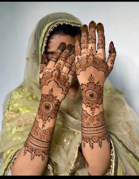 a woman with henna on her hands