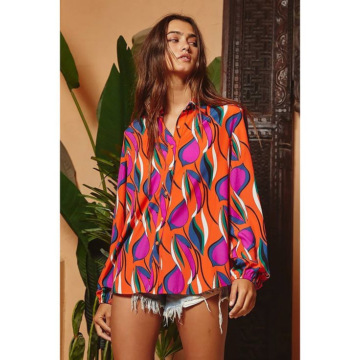 Make a statement in this vibrant floral print button-down blouse! Trendy V-neck Blouse With Vibrant Print, Vibrant V-neck Blouse For Day Out, Multicolor Blouse For Vacation, Chic Multicolor V-neck Shirt, Colorful Pattern Long Sleeve Blouse For Spring, Colorful Long Sleeve Blouse For Spring, Vibrant Print Tops For Vacation, Multicolor Print Top For Fall Day Out, Multicolor Print Top For Day Out In Fall