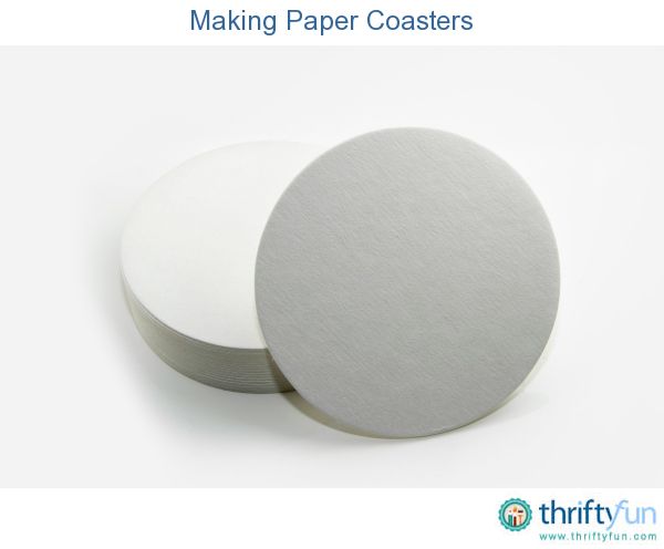 two white paper coasters sitting next to each other