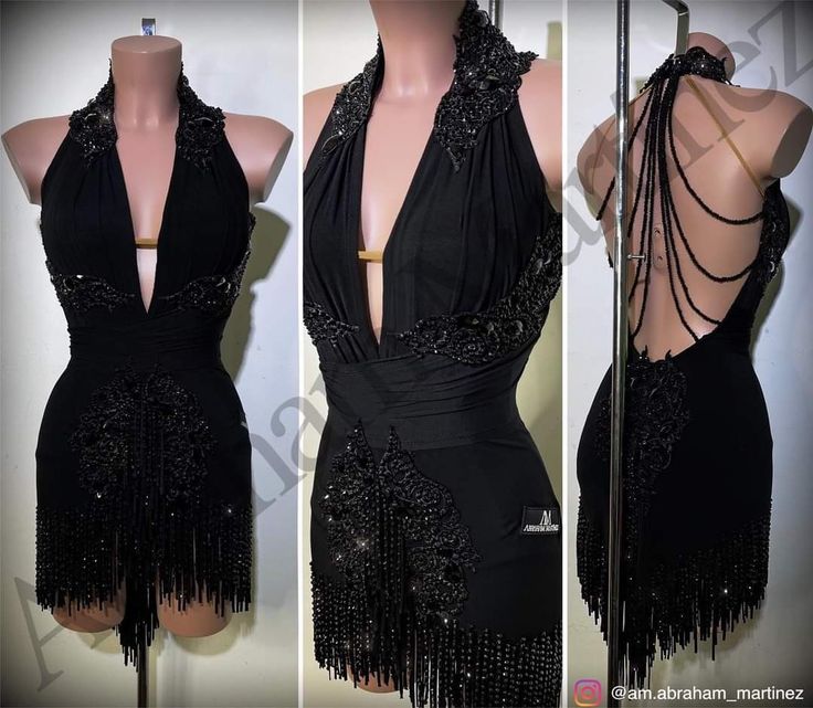 the back of a black dress with fringes on it and an open neckline