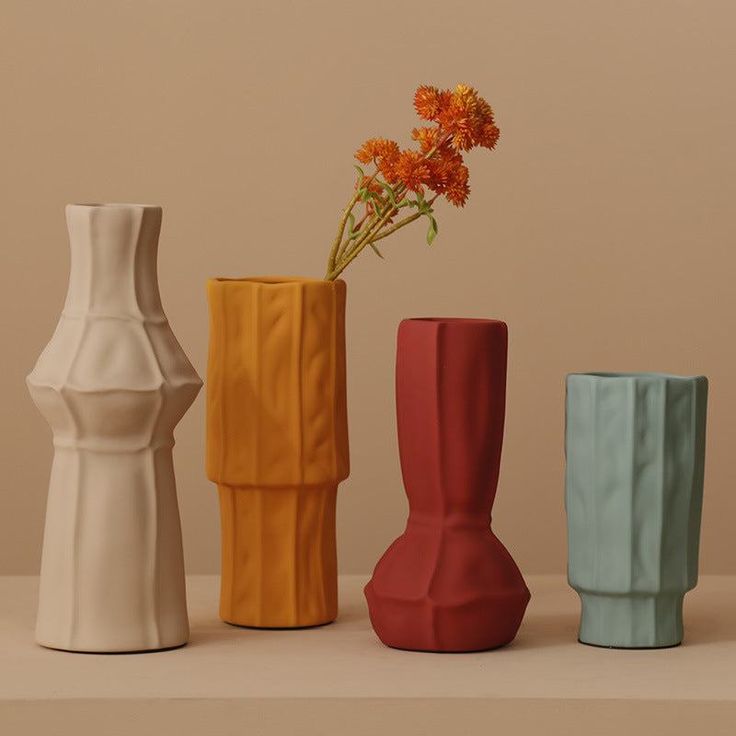 Stitched Vase With Morandi Color That Never Go Wrong In Styles Introducing the Morandi Color Stitched Ceramic Vase, the perfect addition to elevate any room in your home. This stunning vase is crafted from high-quality ceramic and features a beautiful stitched design in warm and muted Morandi colors, including soft pinks, blues, and greys.At 9.5 inches tall, this vase is the ideal size to display your favorite fresh or dried flowers, adding a touch of natural beauty to your living space. Its unique design and subtle color palette make it a versatile piece that can complement any decor style, from modern to rustic.Not only is the Morandi Color Stitched Ceramic Vase a beautiful decor item, but it is also a functional piece for your home. It is crafted to withstand everyday use, making it a d Giorgio Morandi, Nordic Vase, Grey Vases, Yellow Vase, Geometric Vases, Colored Vases, Red Vases, Handmade Ceramics Vase, White Pottery