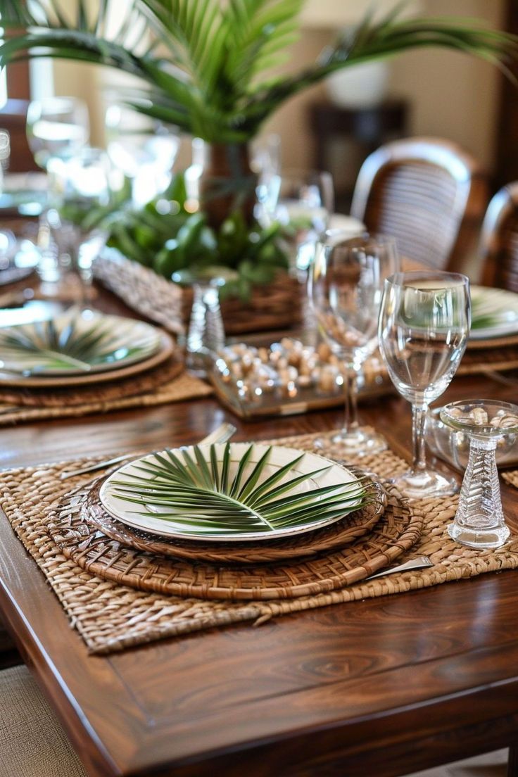 the table is set with plates and glasses