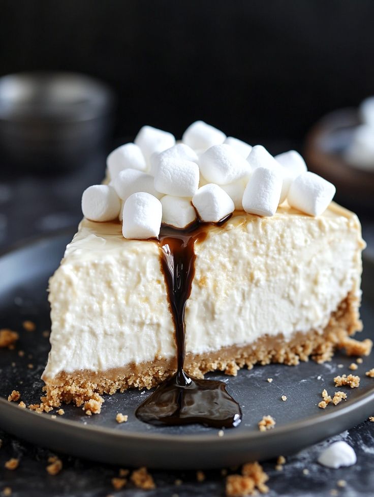 a slice of cheesecake with marshmallows on top