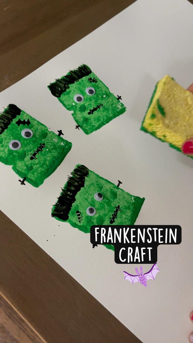 someone is making some cute crafts with sponges on the paper and paint them green