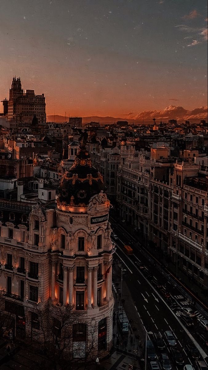 an aerial view of a city at sunset