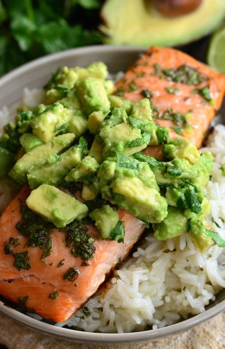 salmon with avocado and rice in a bowl