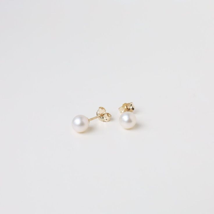 A simple clean white pearl post earring with a 14K gold post and earring back. Great on its own or layered with hold hoops or even other pearls. They make a great everyday staple that goes with almost everything. 14K Yellow Gold 6MM Pearl Stud Made in Rode Island, USA Minimalist Everyday Akoya Pearl Earrings, Minimalist Akoya Pearl Earrings For Everyday, Classic Everyday Akoya Pearl Earrings, Everyday Akoya Pearl Earrings, Minimalist 14k Gold White Pearl Earrings, Minimalist Yellow Gold Pearl Earrings For Everyday, Everyday Yellow Gold Pearl Earrings, Minimalist White Pearl Earrings In 14k Gold, Everyday Yellow Gold Round Pearl Earrings