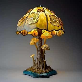 a lamp that is sitting on top of a table next to a tree stump and mushrooms