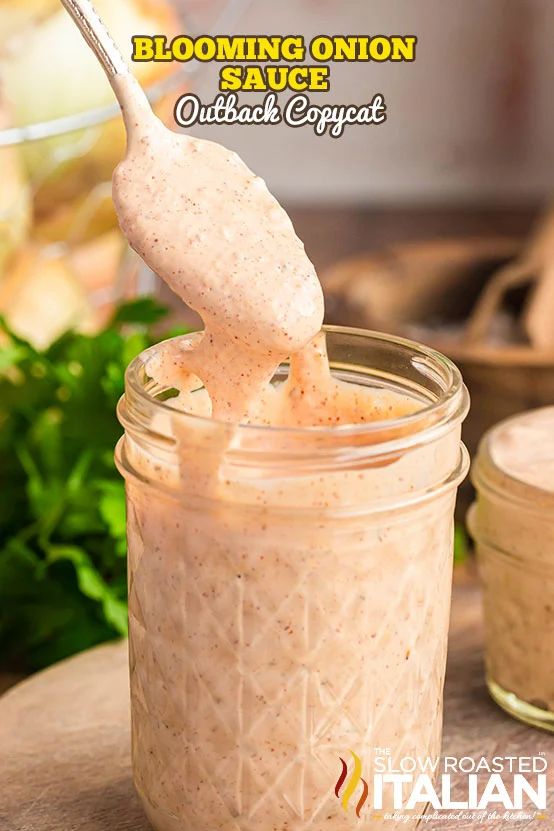 a spoon is sticking out of a jar filled with food