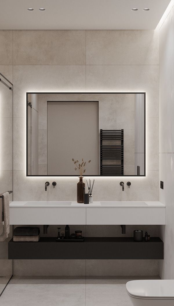 a bathroom with two sinks and a large mirror