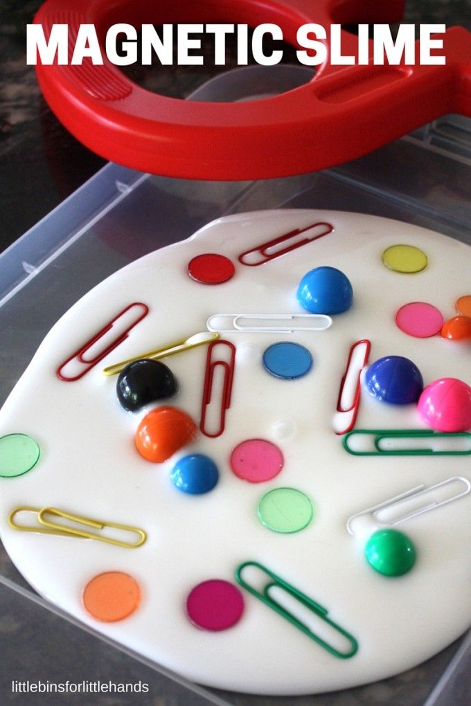 this is an image of a plastic slime tray with magnets and paper clips on it