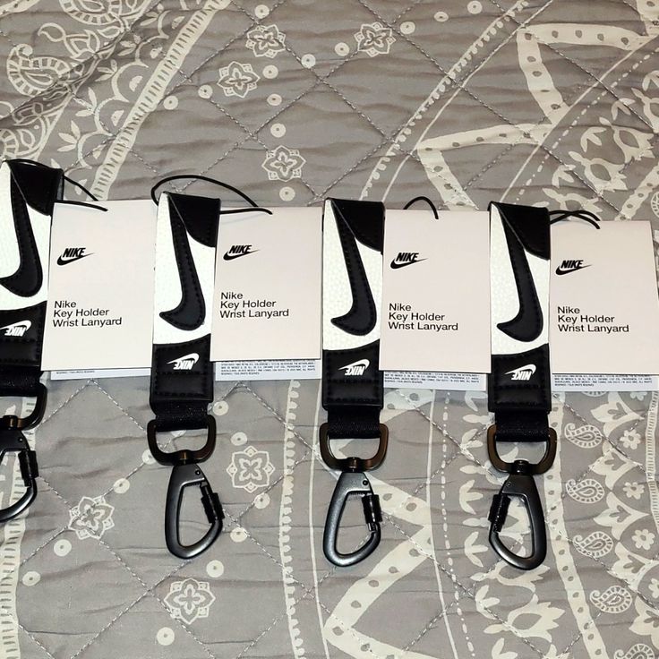 Stylish Key Holder In Black And White. Nike Lanyard, Jordan White, Wrist Lanyard, Purple Nikes, Nike Gold, Nike Accessories, Red Nike, Pink Nikes, Grey Nikes