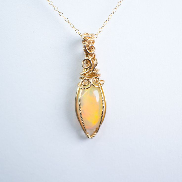 Fire Opal pendant wire wrapped by hand in 14K GOLD filled. Comes with 14K GOLD filled chain 18 inches. Rainbow Opal, Opal Pendants, Opal Necklace, Gold Filled Chain, Fire Opal, Wire Wrapped, Wire Wrapping, Gold Chains, Gold Filled