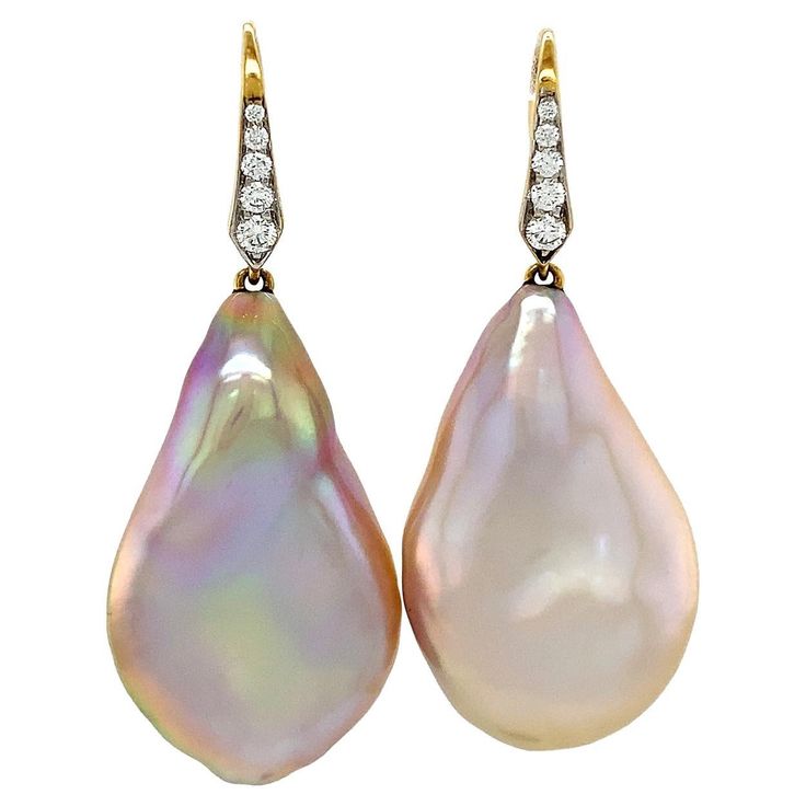 Baroque freshwater pearls are acclaimed in these drop earrings. 18k yellow gold lever backs with pave set brilliant cut diamonds glimmer as they suspend pearls of an irregular teardrop shape. While the bodies have a delicate warm overtone, the light reflects a prismatic array of colors across the valleys and ridges of the pearls. The total weight of the gems are 0.17 carats of diamonds and 2 carats of baroque freshwater pearls. Measurements for the earrings are 0.68 inches (width) by 1.60 inches Yellow Gold Drop Earrings, Freshwater Pearl Drop Earrings, Jewelry Design Drawing, David Webb, Jeweled Earrings, Baroque Pearl Earrings, Textile Designer, Gold Earrings Designs, Pearl Diamond