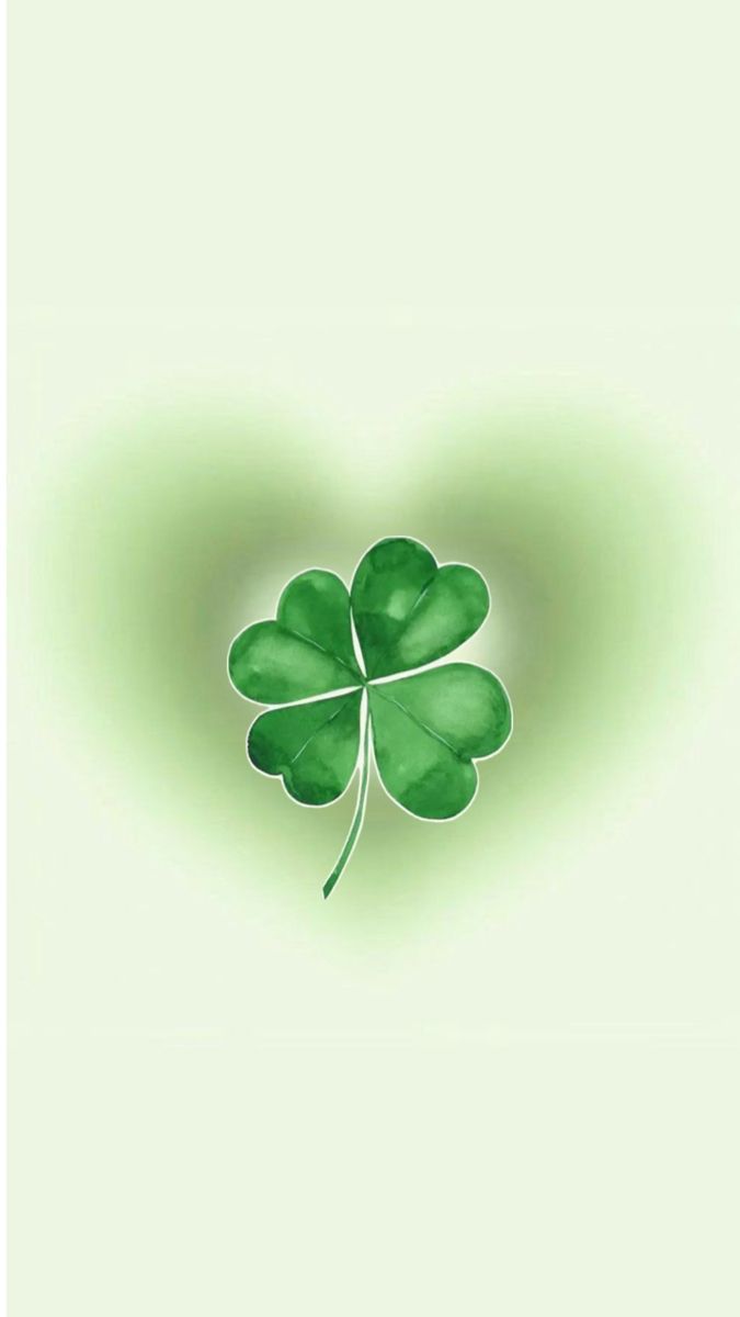 a four leaf clover in the shape of a heart on a green and white background