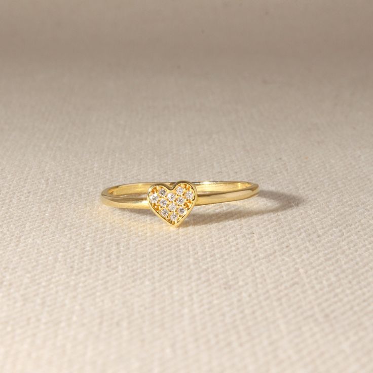 Gold Minimalist Heart Ring is designed simply and stylishly. Fitted by the unique handcraft Isea. There are 11 diamonds on it in total. ➤ Ring Details * 14k / 18k Yellow Gold or Yellow Sterling Silver * Gold Color Options; 14K / 18k White, Yellow, Rose Gold * Band Width: 1.70 mm * Thickness: 1.40 mm ➤ Gem Details * Gemstones: Moissanite * Gem width: 1.10 mm * Gem length: 1.10 mm * Cut Type: Round * Ready to Ship 3-5 Business Days 💍 ISEA Jewels' pieces are handcrafted by 10-15 years of experienc Valentine's Day Heart Ring With Single Diamond, Dainty Diamond Heart Ring Gift, Valentine's Day Dainty Heart Ring With Diamond Accents, Minimalist Diamond Heart Ring For Anniversary, Minimalist Heart-shaped Diamond Ring For Valentine's Day, Valentine's Day Minimalist Heart Diamond Ring, Gold Heart Ring, Silver Heart Ring, Ringe Gold