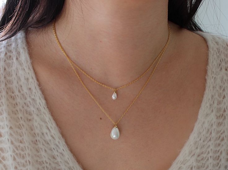 This gorgeous freshwater Pearl Pendant Necklace is the perfect piece of fashion jewelry to add a touch of elegance to any outfit. The Pearl PendantNecklace can be worn on it's own or can easily be layered with our necklaces from our pearl collection. Wear this to any occasion and be ready to shine! Details: Beaded satellite chain Necklace length - 16" plus 2.5" extender chain Pearl measures 9mm x 5mm 15mm x 10mm SHIPPING & PACKAGINGAll items come packaged in a small jewelry box which is perf Everyday Pearl Drop Jewelry, Everyday Drop Pearl Jewelry, Pearl White Necklaces With Pearl Drop For Layering, Elegant Pearl Pendant Necklaces For Layering, Pearl White Necklace With Pearl Drop For Layering, Pearl White Drop Necklace For Gift, Elegant Layering Pearl Pendant Necklaces, Everyday Drop Pearl Chain Jewelry, Pear-shaped Pearl Drop Necklaces