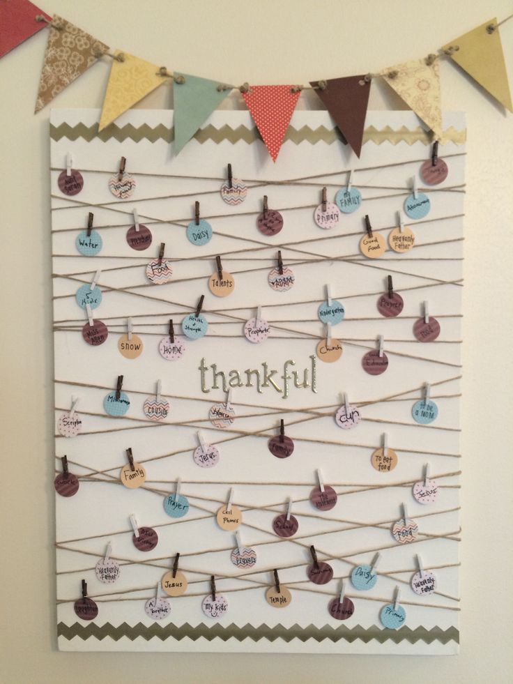 a bulletin board with clothes pins attached to it that says, thank you for thanksgiving