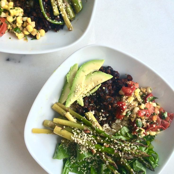 two white bowls filled with different types of food