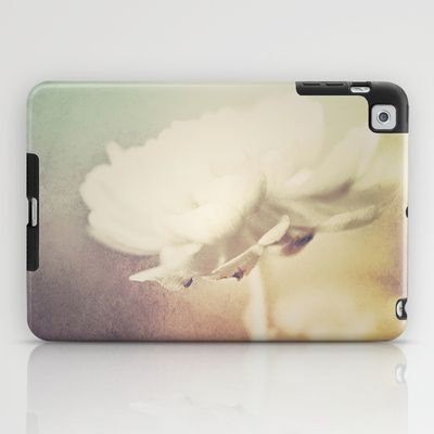 an ipad case with a white flower on it