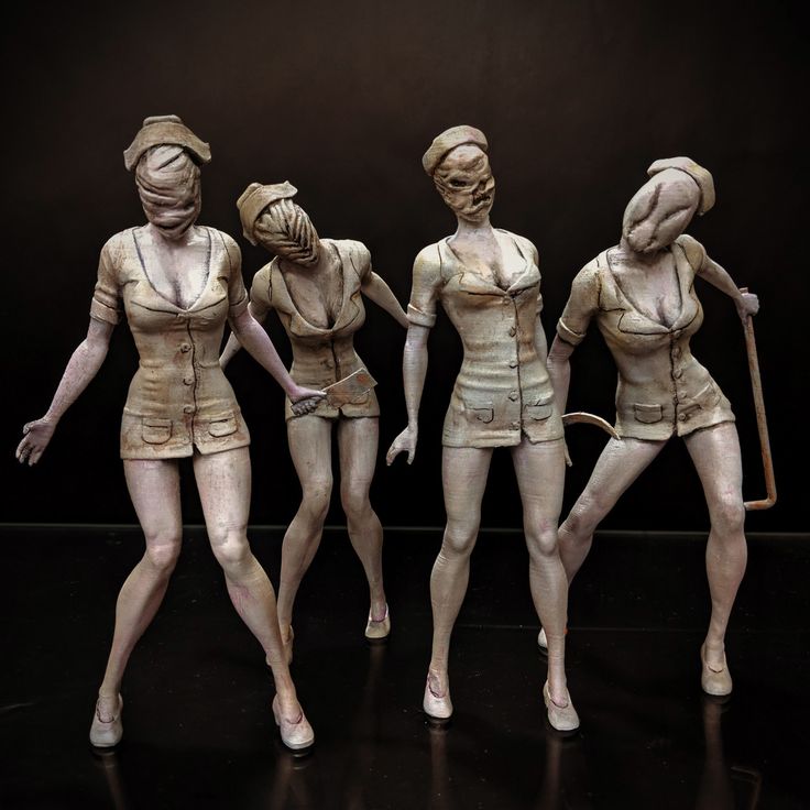 three statues of women in different poses with one holding a cane and the other wearing short shorts