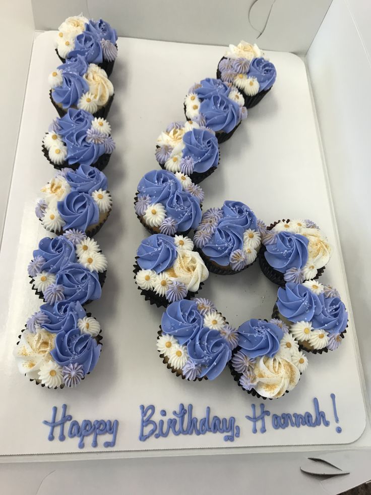 a birthday cake with blue and white cupcakes in the shape of the number 50