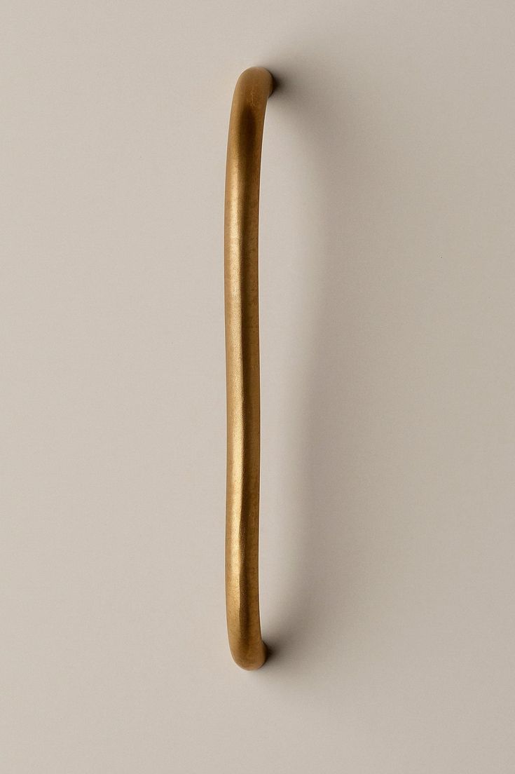 a wooden handle on a white wall