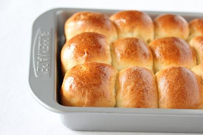 bread rolls in a baking pan ready to be baked