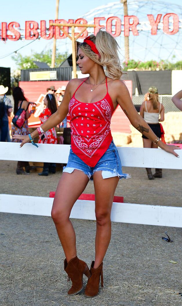 This bandana halter top in rich red is crafted from 100% rayon and features an adjustable tie back and neck for a perfect fit. Flattering and comfortable and light weight. Model is 5'8" with measurements of 33-25-33. One size Red festival top made in the U.S.A. OUR GUARANTEE TO YOU: If you are not 100% satisfied with your purchase, you can return your order to us within 30 days for a refund, exchange or store credit. Shipping charges are not refundable. (Returns must be unworn, in the state you Red Summer Halter Top With Tie Back, Summer Festival Bandana, Summer Bandana With Bandana Print, Bohemian Bandana For Beach In Summer, Halter Neck Top For Music Festival, Bohemian Fitted Bandana For Festivals, Casual Red Festival Tank Top, Casual Summer Festival Bandana, Casual Halter Neck Top For Festivals