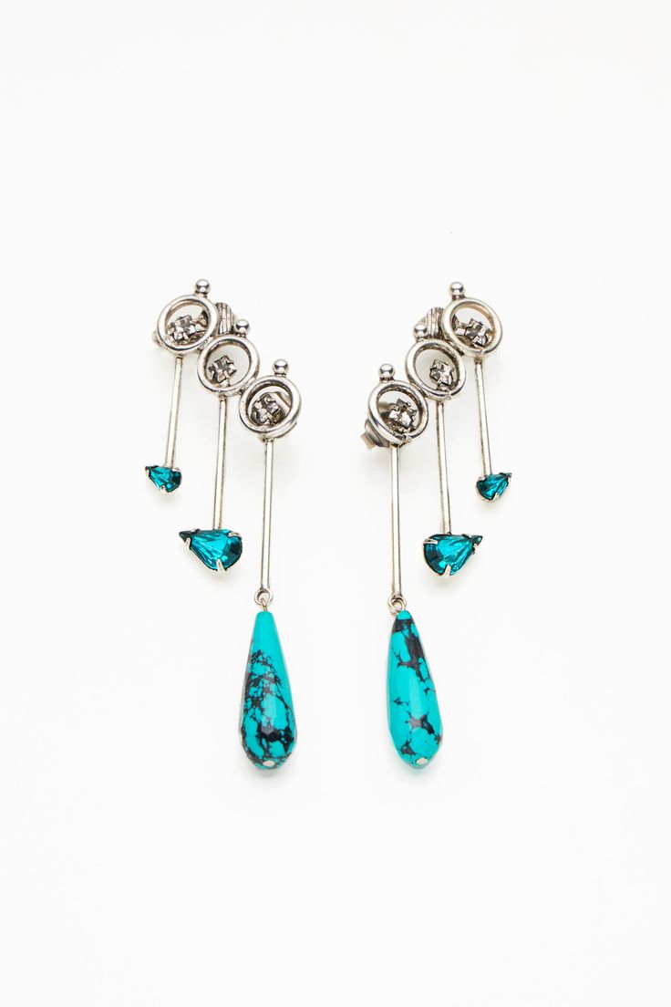 Playful, fierce, elegant. The turquoise colored stones give complexity to these earrings looking like little bow and arrows falling down your ear for an edgy look. Turquoise Earrings For Evening, Colored Stones, Perfect Wardrobe, Edgy Look, Falling Down, Turquoise Color, Lady Gaga, Ring Bracelet, Kendall Jenner