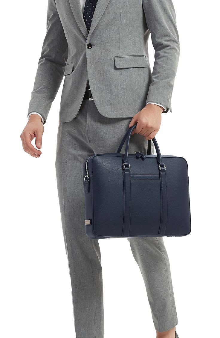 Compact and distinctive, this briefcase crafted from textured leather keeps your smartphone, laptop and other business essentials organized and easy to access. A detachable shoulder strap allows for hands-free carrying on your commute or between meetings. 16.3"W x 11.6"H x 2.6"D Lined Fits most 16" laptops Structured silhouette with flat base for stability Water-resistant Leather Imported Luxury Textured Leather Laptop Bag For Formal Use, Saffiano Leather Shoulder Bag For Business, Business Shoulder Bag In Saffiano Leather, Modern Textured Leather Shoulder Bag For Business, Elegant Textured Leather Laptop Bag For Formal Occasions, Elegant Textured Leather Laptop Bag For Formal Use, Leather Shoulder Briefcase For Work, Leather Briefcase With Detachable Strap For Business, Leather Briefcase With Detachable Strap For Office