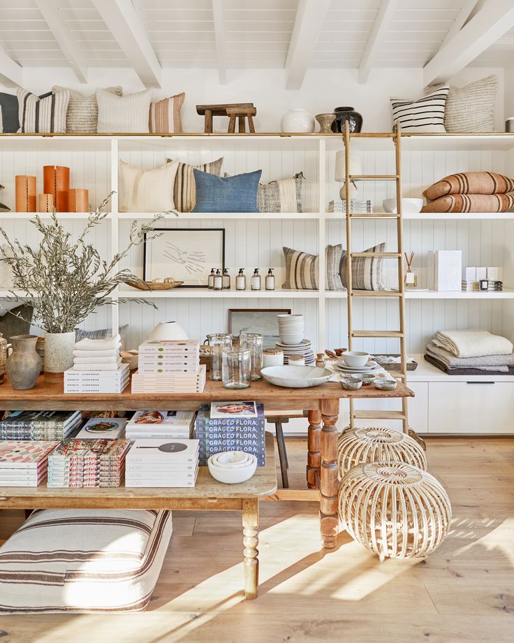 a room filled with lots of different types of furniture and decor on shelves next to each other