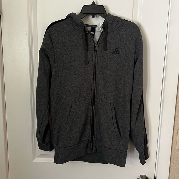 Gray Adidas Zip Up Hoodie In Size Medium. Never Worn. Cozy Sports Outerwear With Double-lined Hood, Gray Fleece Sweatshirt For Cold Weather, Adidas Fleece Hoodie With Ribbed Cuffs, Adidas Sweatshirt With Double-lined Hood For Fall, Adidas Track Jacket With Drawstring Hood, Adidas Long Sleeve Track Jacket With Drawstring Hood, Gray Fleece Outerwear With Ribbed Cuffs, Adidas Long Sleeve Fleece Sweatshirt, Adidas Sports Hoodie Outerwear