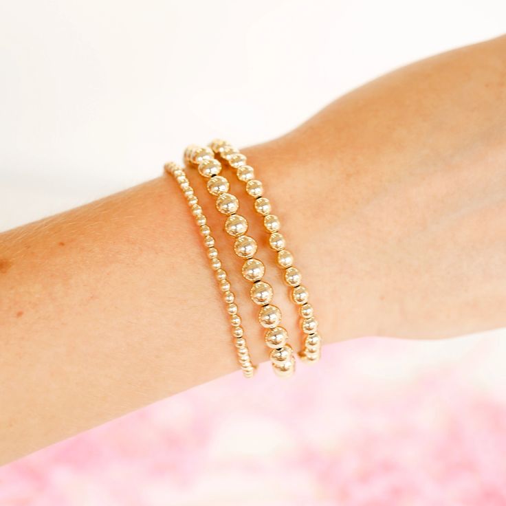 Looking for a basic to start your stack? Wanting to add to your current collection? You’ve come to the right place. These are a staple in your beaded stack. Our gold stackable beaded bracelets are available in a variety of bead sizes and lengths to fit every wrist. Made from 14 k gold filled beads so perfect for everyday wear! Sweat proof, waterproof and tarnish free! Size: Standard (6.75 inches) | Extended (7.25 inches) | Extended Plus (8 inches) These bracelets are handstrung with love in Coll Trendy Stackable Wrap Bracelet With Round Beads, Everyday Stackable Beaded Bangle Bracelets, Gold Bracelets With Round Beads For Layering, Gold Minimalist Bracelets With Faceted Beads, Gold Stackable Wrap Bracelet For Stacking, Gold Bracelets With Tiny Beads For Layering, Gold Stretch Bracelet With Faceted Beads, Trendy Gold Beads Stretch Bracelet For Everyday, Trendy Gold Beaded Stretch Bracelet For Everyday