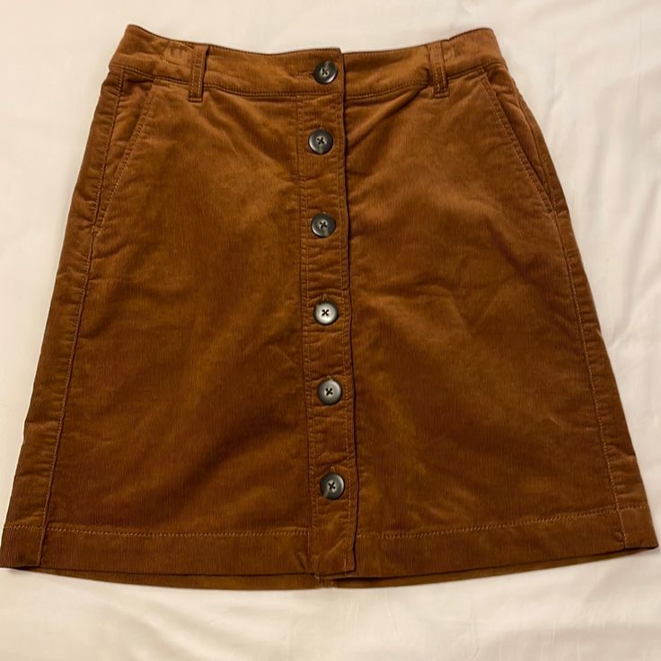 Brown, Button Down Corduroy Skirt. Never Worn. Great Quality! Brown Corduroy Bottoms With Buttons, Brown Cotton Skirt With Buttons, Fall Corduroy Button-up Bottoms, Casual Corduroy Button-up Bottoms, Fall Cotton Skirt With Buttons, Fall Cotton Skirt With Snap Buttons, Casual Corduroy Skirt With Button Closure, Brown Corduroy Skirt, Skirts Brown