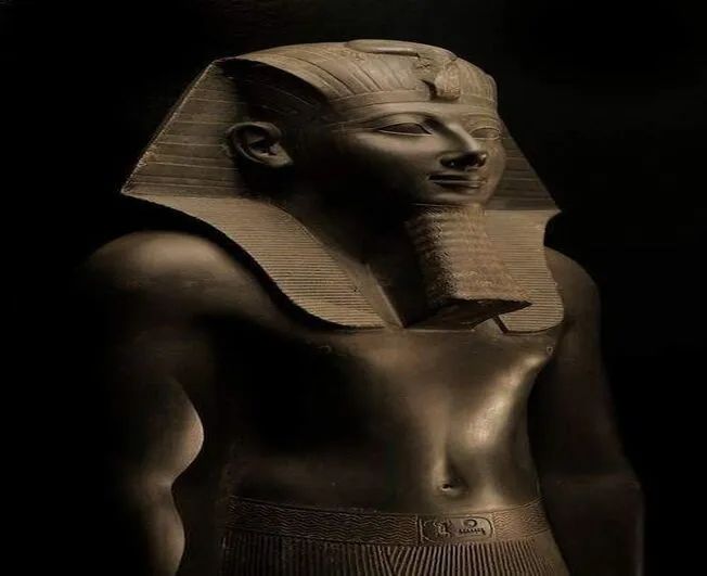 an egyptian statue with the head of tutane on it's chest and neck