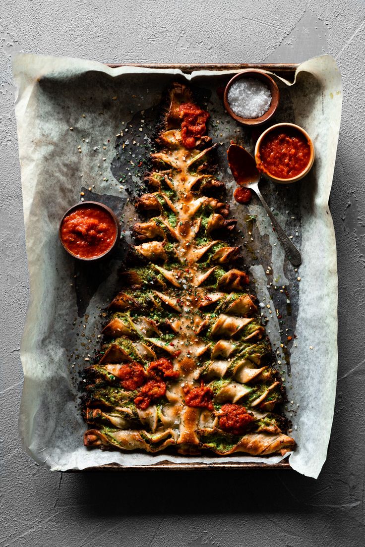 a christmas tree made out of bread and sauces