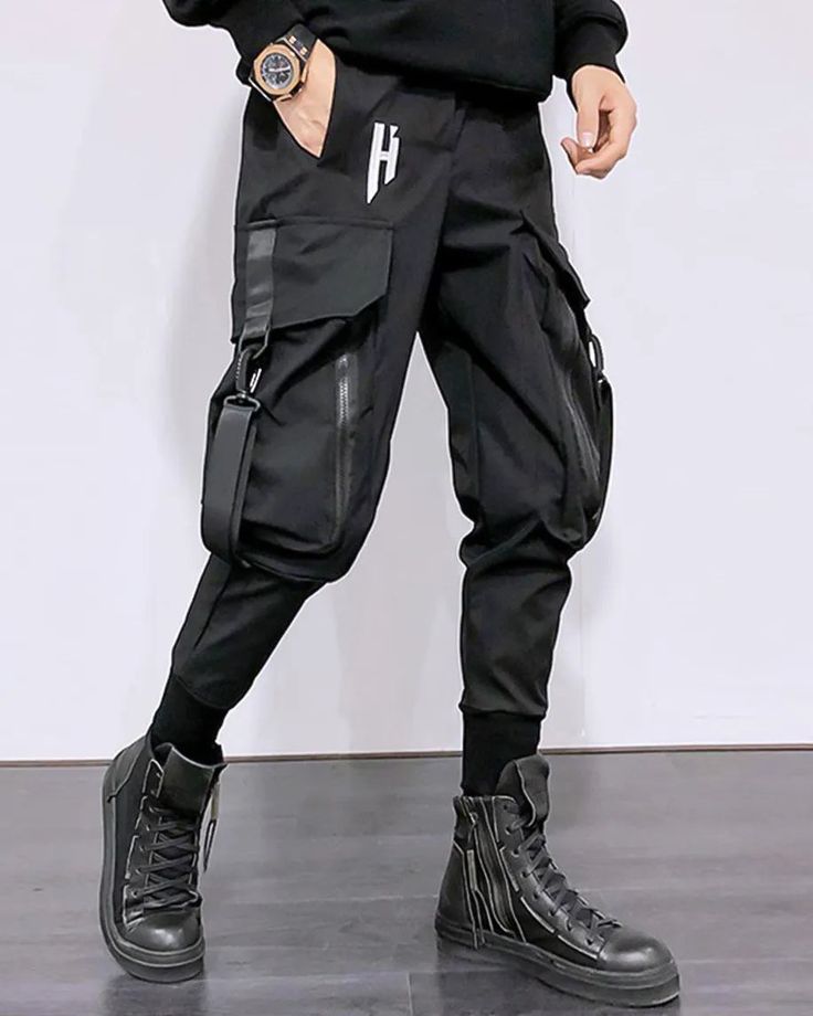 Outstanding techwear style with the "Hanata" Techwear pants Size (cm) Waist Hips Length XS 68 96 97 S 72 100 99 M 76 104 101 L 80 108 103 XL 84 112 105 Keep it simple with the "Hanata" Techwear cargo pants. Indeed, dressing up has never been about the number of clothes you wear. On the contrary, it's about the quality of what you wear. Above all, the style of clothing determines your worth and says a lot more about your personality. As a result, dressing simply is a real art and has become much Techwear Parachute Pants With Functional Pockets, Techwear Bottoms For Outdoor Activities With Hip Pockets, Techwear Sweatpants With Pockets, Full-length Techwear Cargo Jeans With Hip Pockets, Baggy Techwear Pants With Cargo Pockets, Techwear Pants With Side Pockets, Baggy Techwear Pants With Multiple Pockets, Fitted Hip Hop Cargo Pants, Techwear Bottoms With Hip Pockets For Outdoor Activities