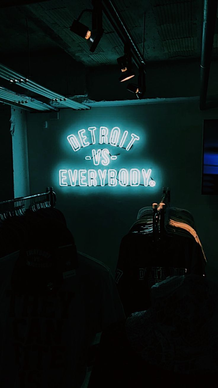 a neon sign that reads detroit vs everybody