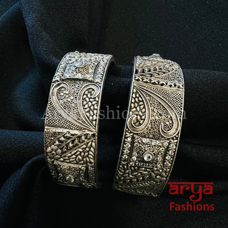 Designer Silver Oxidized Bracelet Bangles- Available Size: 2.6. Can fit size 2.8 due to openable feature.- Silver Oxidized Bracelet bangles in silver finish.- Very Elegant and stylish, this bracelet bangles can be paired with any Attire depending upon the occasion and the theme. - The base is pure brass (90%) and pure 92.5 silver (10%) which makes this very sturdy and of good quality. - 100% guarantee on the finish- it will not lose its finish/color/shine. - Very lightweight and Hand carved.- Op Luxury Oxidized Sterling Silver Bracelet, Silver Metal Bangle For Wedding, Silver Openable Bracelets For Gift, Silver Openable Bracelet For Gift, Silver Openable Bracelets As A Gift, Traditional Silver Bangle For Formal Occasions, Silver Openable Bangle Jewelry, Festive Hand Set Silver Bangle, Openable Silver Bangle Jewelry