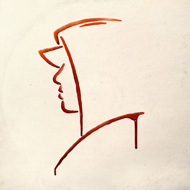 a drawing of a man's face with a hat on his head, in red ink