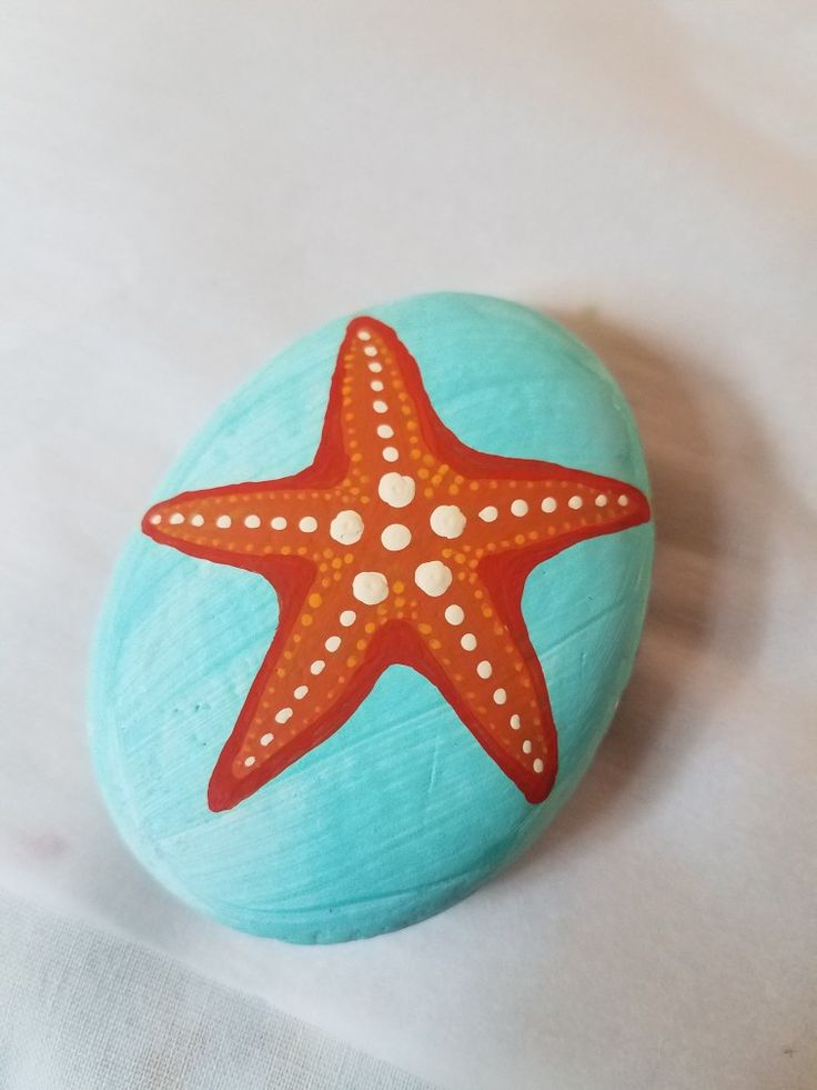 a painted rock with a starfish on it