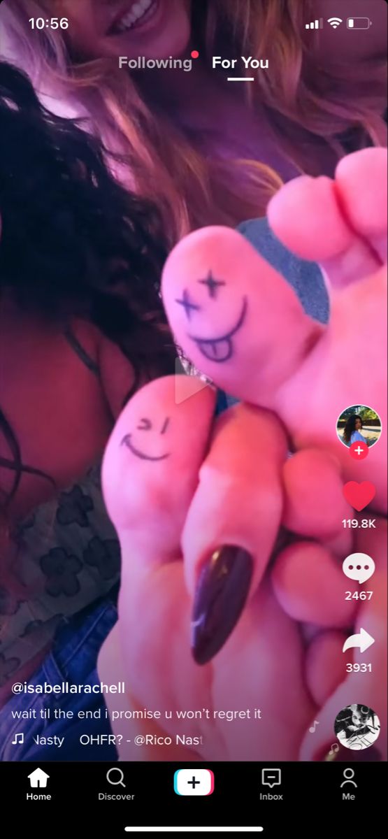 someone is holding out their fingers with smiley faces drawn on them and the caption reads, following for you